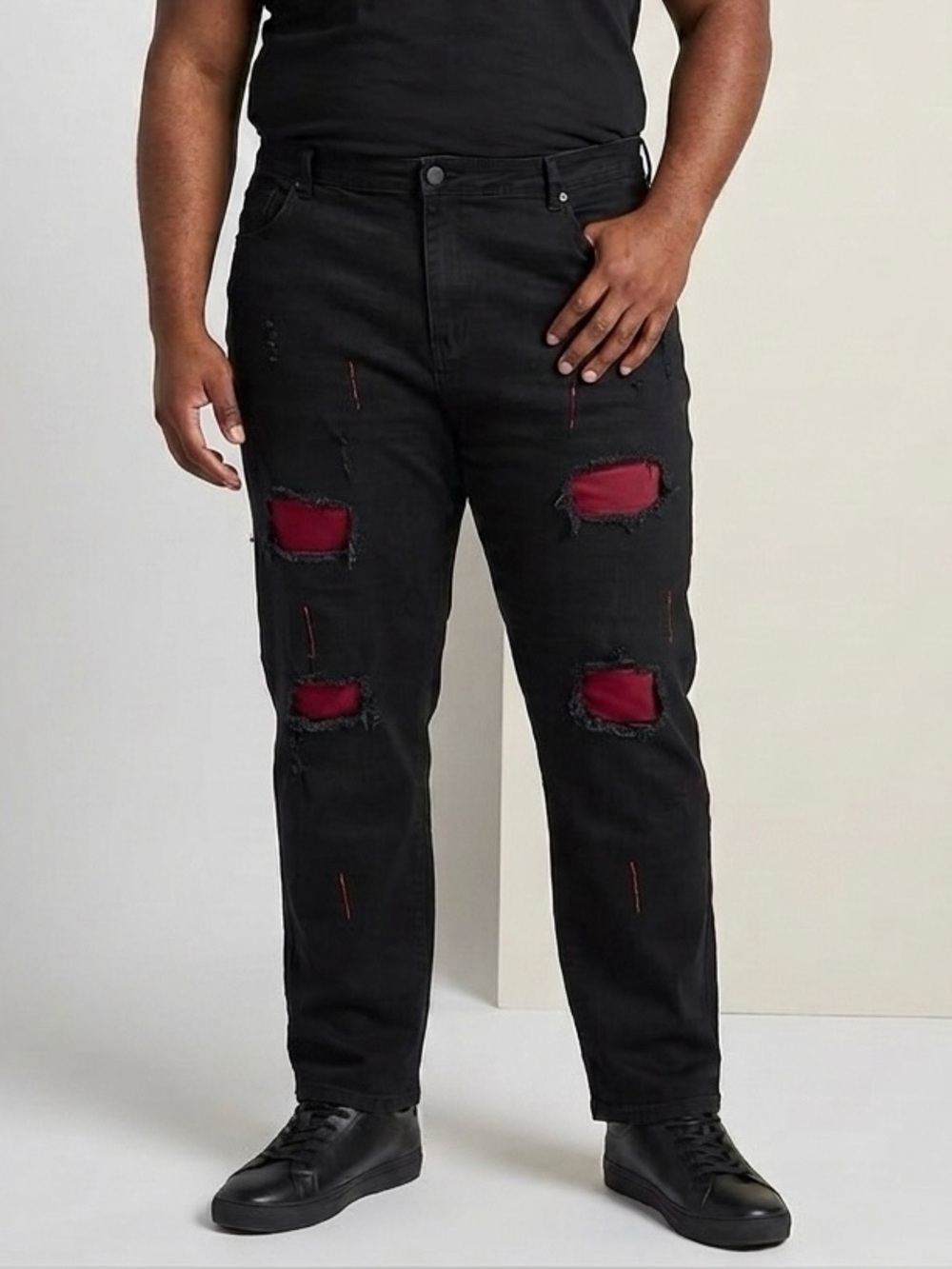 Black stretchy jeans with red underlay. NWOT